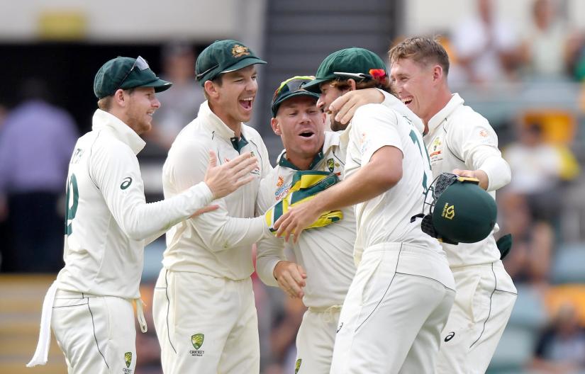 Tim Paine, Steve Smith, Joe Burns, David Warner and Marnus Labuschagne celebrate victory after Australia beat Pakistan on Day 4 of the first Test, at The Gabba in Brisbane, on Sunday (Nov 24). FILE PHOTO