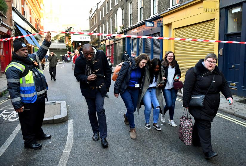 People leave the area near Borough Market after an incident at London Bridge, in London, Britain, November 29, 2019. REUTERS