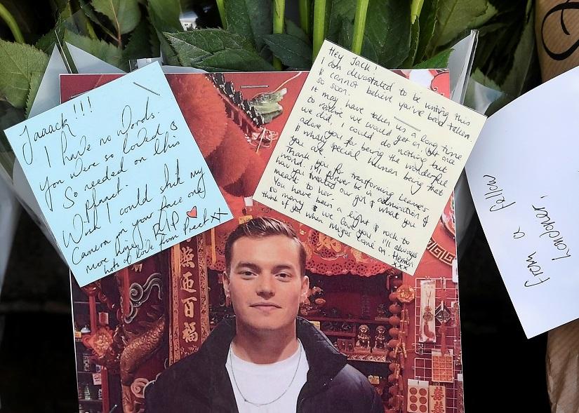 Messages of condolence and floral tributes, including a photograph of victim Jack Merritt, are seen near the scene of a stabbing on London Bridge, in London, Britain, Dec 1, 2019. REUTERS