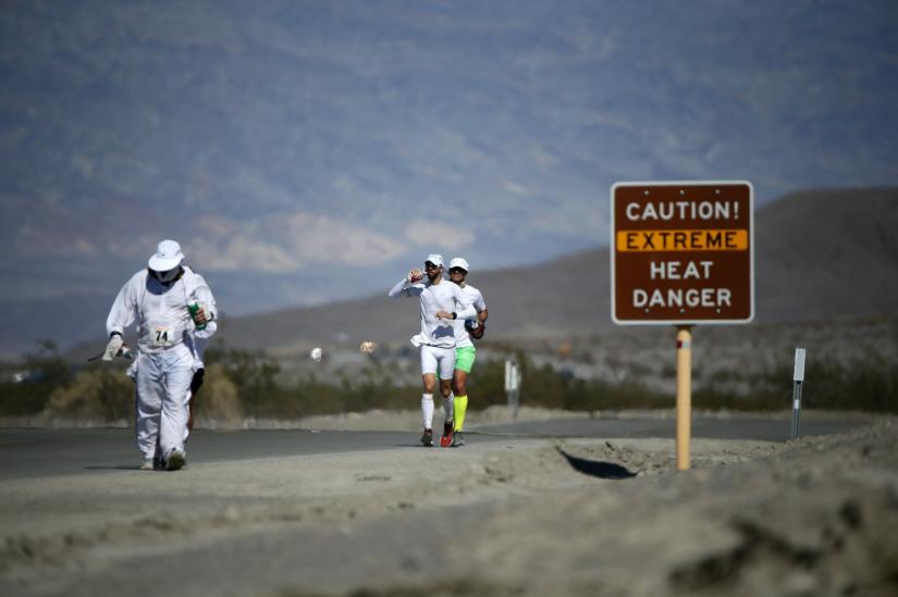 Competitors run in the Badwater Ultramarathon in Badwater Ultramarathon at the Death Valley National Park, California in this July 15, 2013 file photo. ATHLETICS-ULTRAMARATHONS/REUTERS