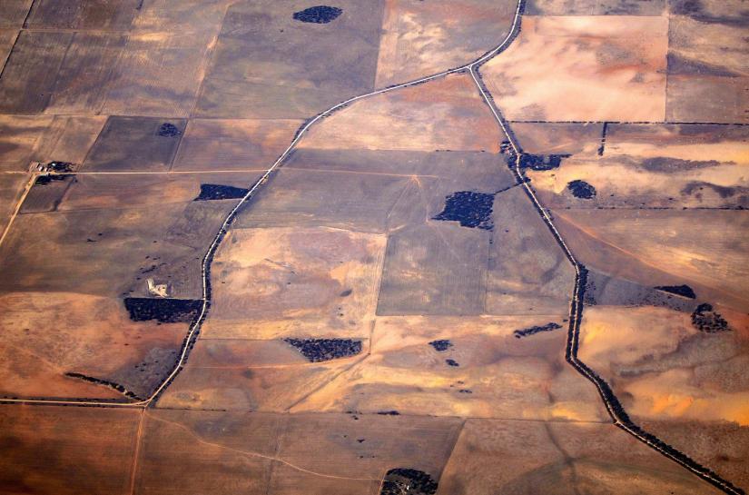 FILE PHOTO: Roads can be seen intersecting drought-affected farming areas southeastern Australia, March 21, 2015. REUTERS