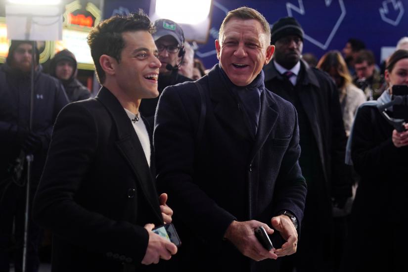 Actors Daniel Craig and Rami Malek talk during a promotional appearance on TV in Times Square for the new James Bond movie `No Time to Die` in the Manhattan borough of New York City, New York, U.S., December 4, 2019. REUTERS