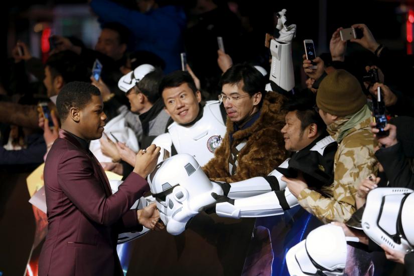 FILE PHOTO: Cast member John Boyega (L) arrives at the China Premiere of the film `Star Wars: The Force Awakens` in Shanghai, China, December 27, 2015. REUTERS