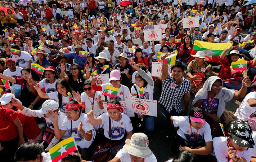 People gather to rally in support of Myanmar State Counsellor Aung San Suu Kyi before she heads off to the International Court of Justice (ICJ), in Yangon, Myanmar December 1, 2019. REUTERS