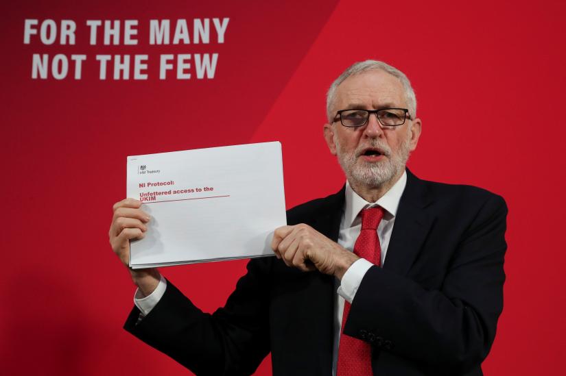 Labour Party leader Jeremy Corbyn shows a document during a news conference in London, December 6, 2019. REUTERS