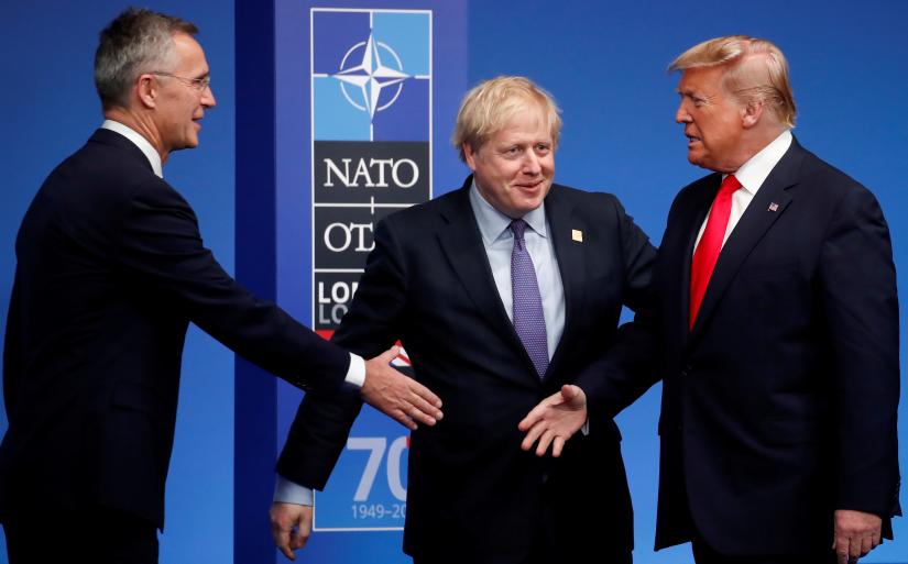 FILE PHOTO: NATO Secretary General Jens Stoltenberg and Britain`s Prime Minister Boris Johnson welcome U.S. President Donald Trump at the NATO leaders summit in Watford, Britain December 4, 2019. REUTERS