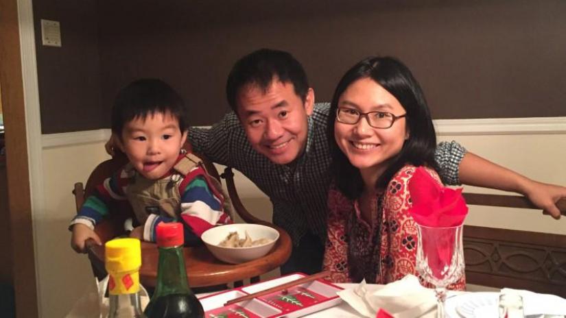FILE PHOTO: Xiyue Wang, a naturalized American citizen from China, arrested in Iran last August while researching Persian history for his doctoral thesis at Princeton University, is shown with his wife and son in this family photo released in Princeton, New Jersey, U.S. on July 18, 2017. Courtesy Wang Family photo via Princeton University/Handout via REUTERS/File Photo
