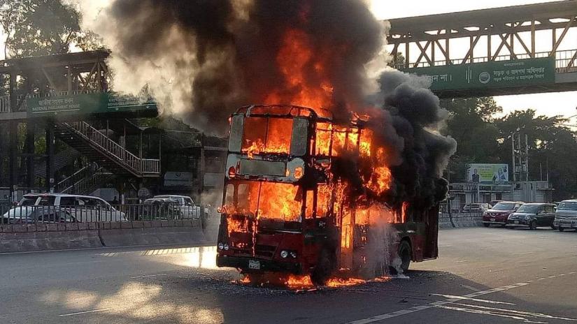 A double-decker bus of the state-run Bangladesh Road Transport Corporation (BRTC) catches fire in front of the Kurmitola General Hospital on the Airport Road around 4pm on Saturday (Dec 7).