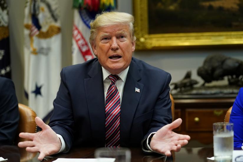 President Donald Trump speaks to reporters while participating in a `roundtable on small business and red tape reduction accomplishments` in the Roosevelt Room at the White House in Washington, U.S. December 6, 2019. REUTERS