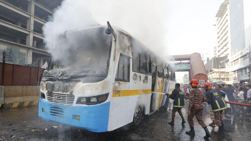 A bus operated by `Trust Paribahan` catches fire in Dhaka`s Karwan Bazar around 3pm on Saturday (Dec 7)