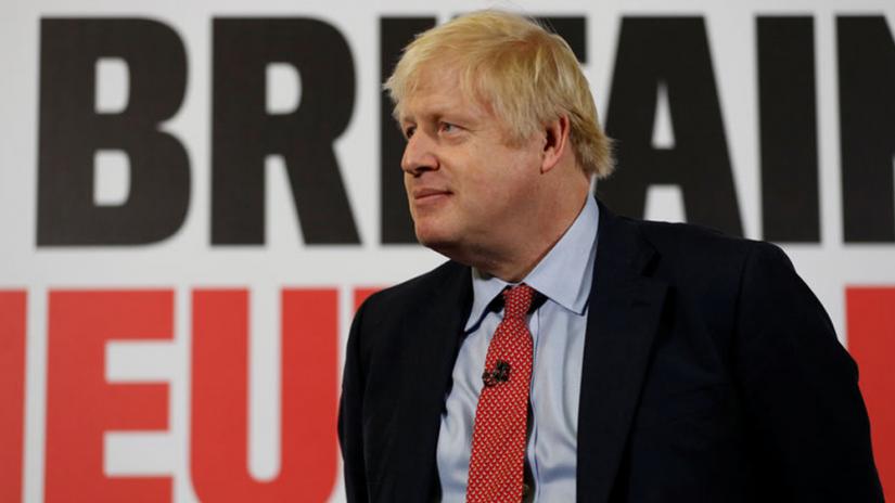 FILE PHOTO: Britain`s Prime Minister Boris Johnson attends the launch of a general campaign poster at the Kent Showground in Detling, Kent, Britain, Dec 6, 2019. REUTERS