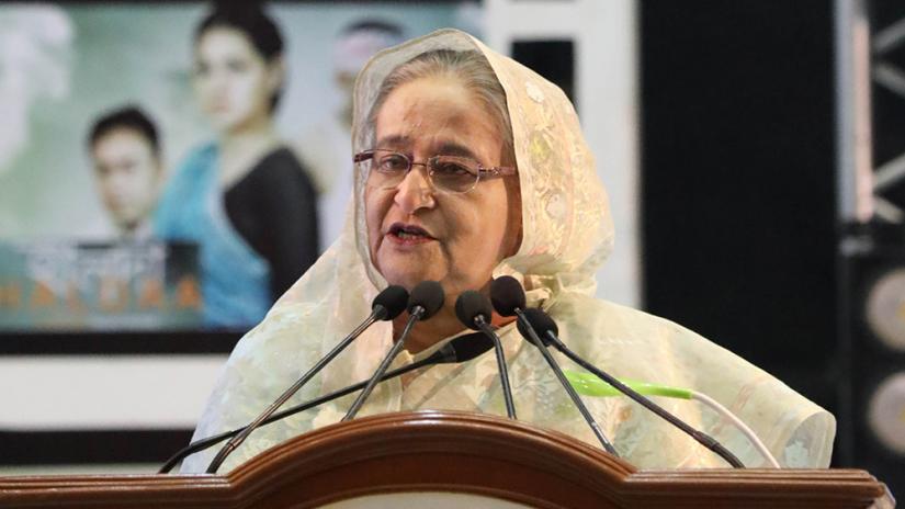 FILE PHOTO: Prime Minster Sheikh Hasina speaks at a award ceremony held at Bangabandhu International Conference Centre (BICC) in Dhaka on Sunday (Dec 8). Focus Bangla