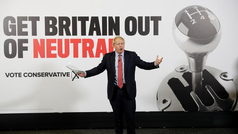 FILE PHOTO: Britain`s Prime Minister Boris Johnson gestures during the launch of a general campaign poster at the Kent Showground in Detling, Kent, Britain, Dec 6, 2019. REUTERS