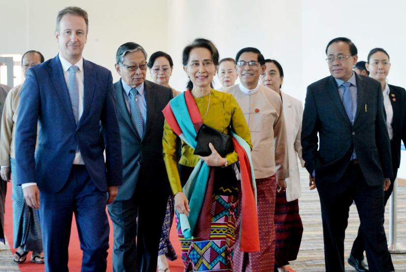 Myanmar`s State Counsellor Aung San Suu Kyi departs from Naypyidaw International Airport ahead of her appearance at the International Court of Justice to defend the country against charges of genocide of its Rohingya Muslim minority, in Naypyidaw, Myanmar, December 8, 2019. Myanmar`s State Counsellor Office/Handout via REUTERS.