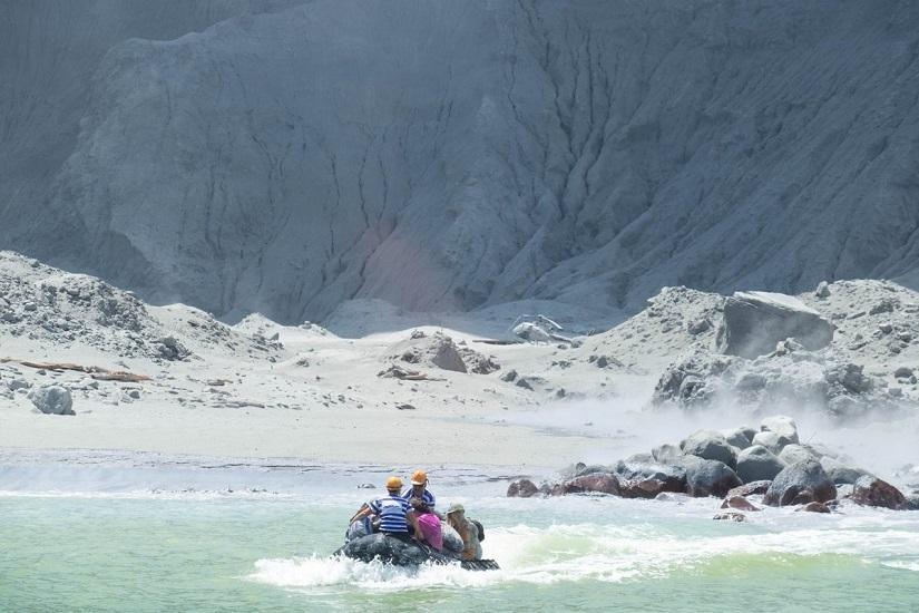 Tour guides evacuate tourists on a boat shortly after the volcano eruption on White Island, New Zealand December 9, 2019 in this picture obtained from social media. @SCH/via REUTERS