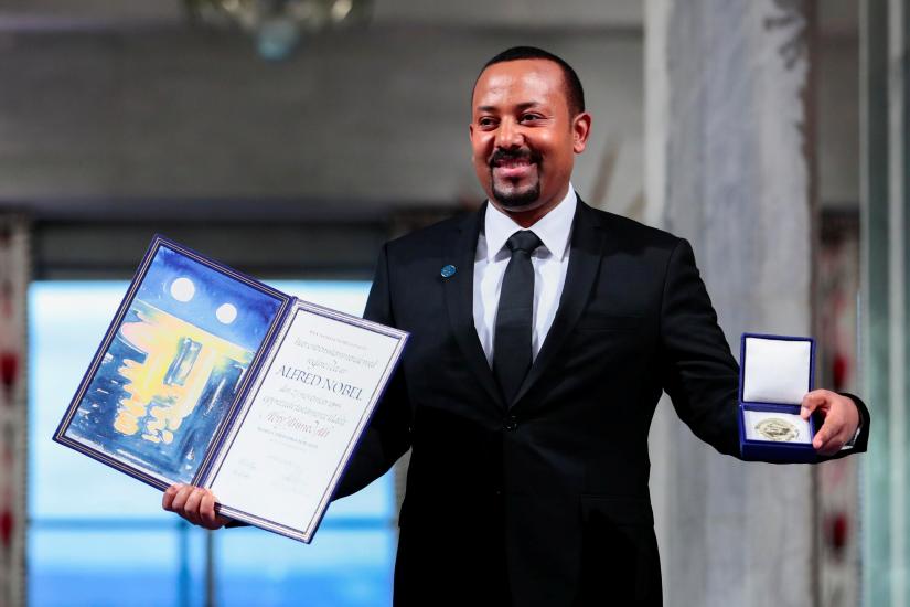 Ethiopian Prime Minister Abiy Ahmed Ali poses with medal and diploma after receiving Nobel Peace Prize during ceremony in Oslo City Hall, Norway December 10, 2019. NTB Scanpix via REUTERS