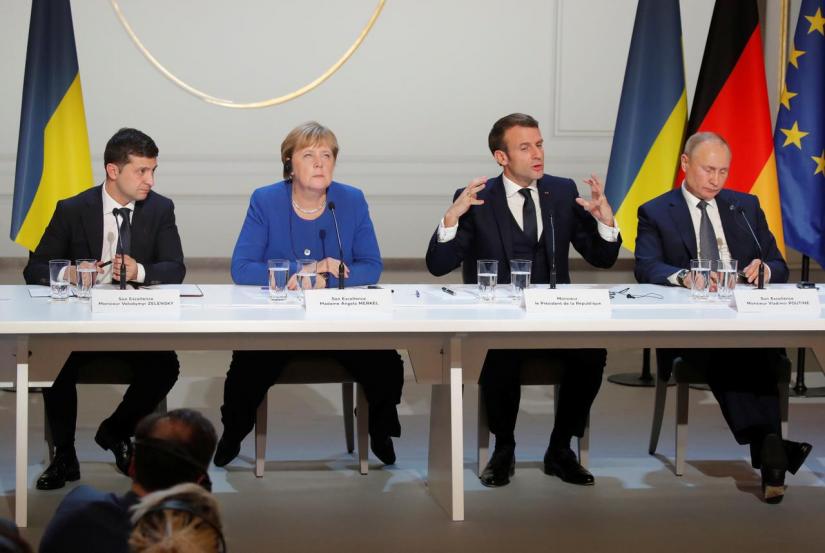 Ukraine`s President Volodymyr Zelenskiy, German Chancellor Angela Merkel, French President Emmanuel Macron and Russia`s President Vladimir Putin attend a joint news conference after a Normandy-format summit in Paris, France, Dec 9, 2019. REUTERS