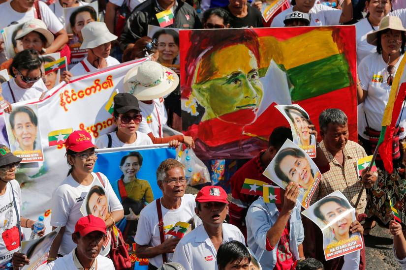 People gather to rally in support of Myanmar State Counsellor Aung San Suu Kyi before she attends a hearing at the International Court of Justice (ICJ), in Yangon, Myanmar December 10, 2019. REUTERS