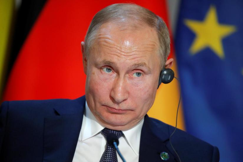 Russia`s President Vladimir Putin attends a joint news conference after a Normandy-format summit in Paris, France, Dec 9, 2019. REUTERS