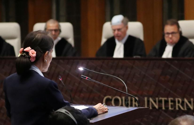 Myanmar`s leader Aung San Suu Kyi speaks in front of the judges on the second day of hearings in a case filed by Gambia against Myanmar alleging genocide against the minority Muslim Rohingya population, at the International Court of Justice (ICJ) in The Hague, Netherlands December 11, 2019. REUTERS