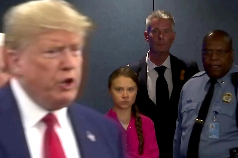 FILE PHOTO: Swedish environmental activist Greta Thunberg watches as U.S. President Donald Trump enters the United Nations to speak with reporters in a still image from video taken in New York City, U.S. September 23, 2019. REUTERS