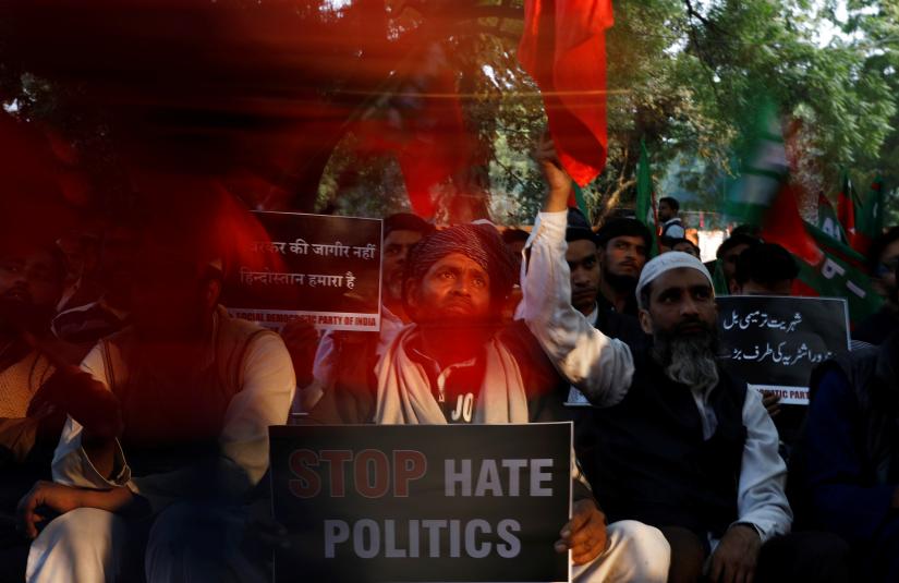 Activists of Socialist Unity Centre of India (SUCI) hold placards during a protest against the National Register of Citizens (NRC) and the Citizenship Amendment Bill (CAB), a bill that seeks to give citizenship to religious minorities persecuted in neighbouring Muslim countries, in Kolkata, India, December 10, 2019. REUTERS