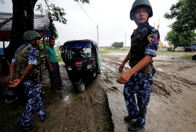 FILE PHOTO: Myanmar police officer stands guard in Maungdaw, Rakhine July 9, 2019. REUTERS/File Photo