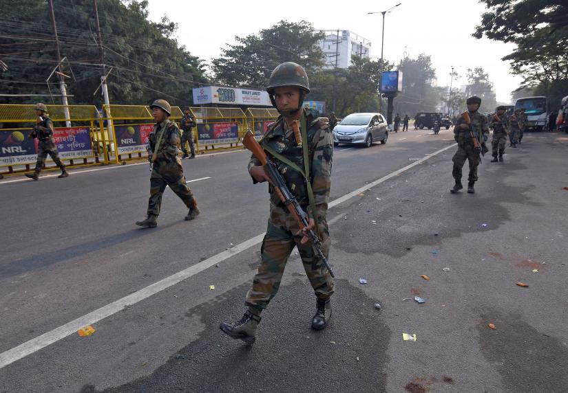 Soldiers patrol a street following protests after India`s parliament passed Citizenship Amendment Bill, in Guwahati, India December 12, 2019. REUTERS