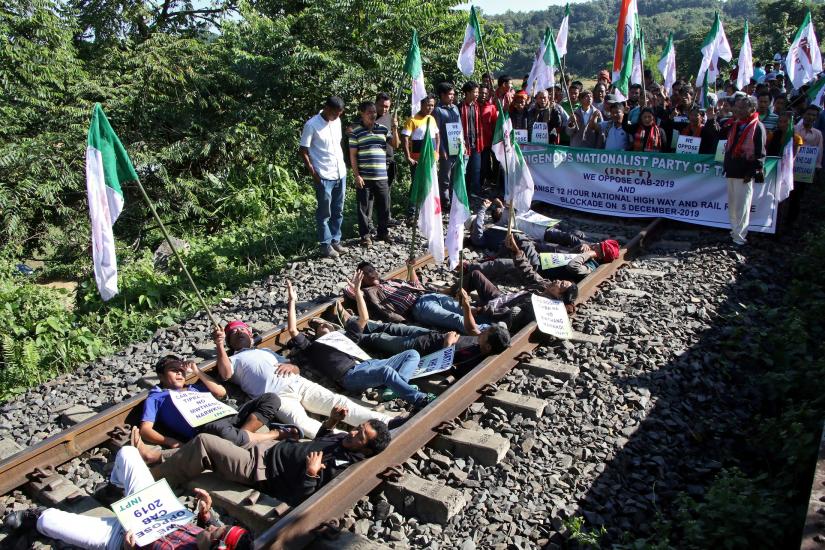 Activists from Indigenous Nationalist Party of Twipra (INPT) shout slogans as they block a railway track during a protest against the Citizenship Amendment Bill, a bill approved by India`s cabinet to give citizenship to religious minorities persecuted in neighboring Muslim countries, in at Khamtingbari on the outskirts of Agartala, India December 5, 2019. REUTERS