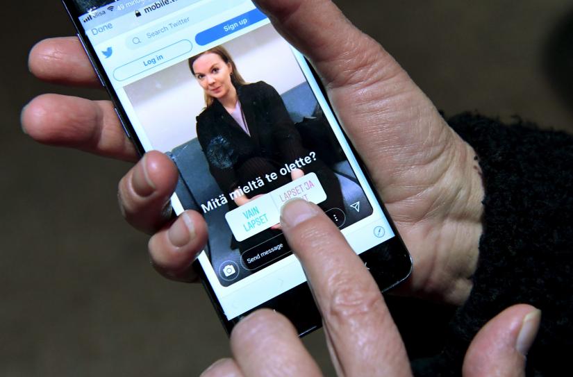 An Instagram post depicting Finnish Finance Minister Katri Kulmuni is seen on a phone running the Twitter app in Helsinki, Finland December 13, 2019. Lehtikuva via REUTERS