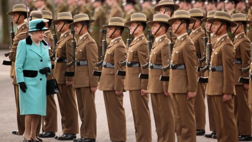 Britain`s Queen Elizabeth inspects some of her Gurkha soldiers, in southern England, 2011.Reuters