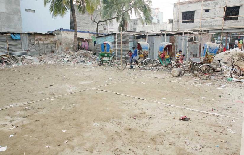 A fraction of a six decimal mass killing field at New C Block in Mirpur 1 near Rainkhola appears to be a rickshaw garage where a badminton court has recently been set up. PHOTO/Syed Zakir Hossain