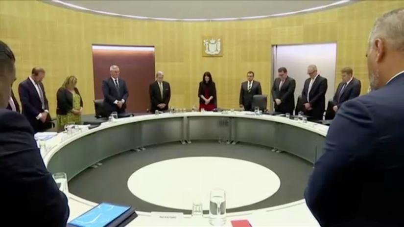 New Zealand`s Prime Minister Jacinda Ardern and fellow politicians observe a minute of silence, to mark one week since the deadly eruption of White Island, in Wellington, New Zealand, December 16, 2019, in this still image taken from video. TVNZ via REUTERS TV