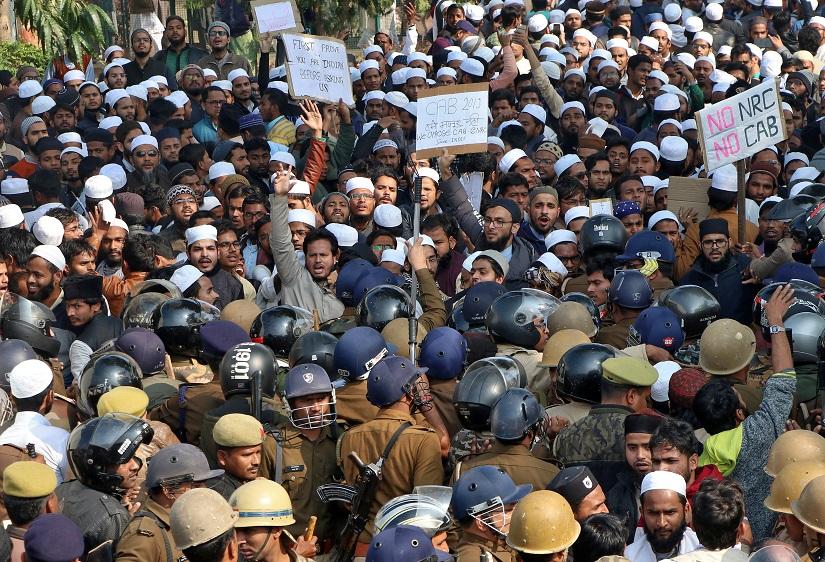 Students of Darul Uloom Nadwatul Ulama, an Islamic university, shout slogans as they are stopped by police during a protest against a new citizenship law, in Lucknow, India, Dec 16, 2019. REUTERS