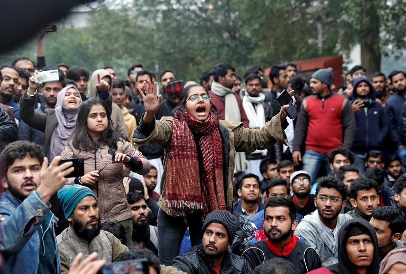 A student of the Jamia Millia Islamia university reacts during a demonstration after police entered the university campus on the previous day, following a protest against a new citizenship law, in New Delhi, India, Dec 16, 2019. REUTERS