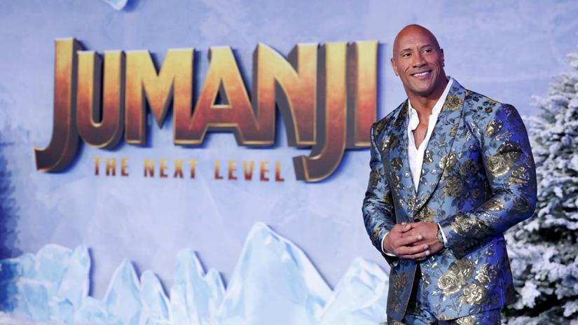 FILE PHOTO: Cast member Dwayne Johnson poses at the premiere for the film `Jumanji: The Next Level` in Los Angeles, California, US, Dec 9, 2019. REUTERS