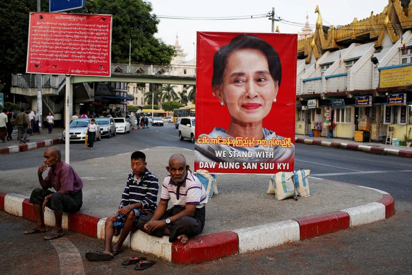 A poster supporting Aung San Suu Kyi as she attends a hearing at the International Court of Justice is seen in a road in Yangon, Myanmar, December 12, 2019. REUTERS/File Photo