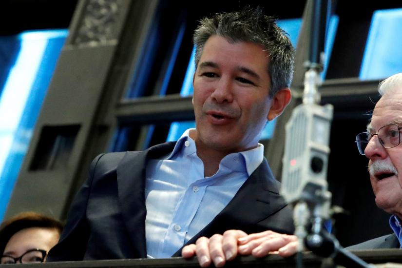 Former Uber Technologies Inc. CEO and co-founder Travis Kalanick stands on a balcony above the trading floor of the New York Stock Exchange (NYSE) during the company`s IPO in New York, U.S., May 10, 2019. REUTERS