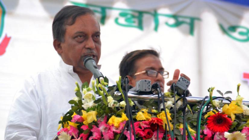 This undated file photo shows Home Minister Asaduzzaman Khan speaking at a programme.