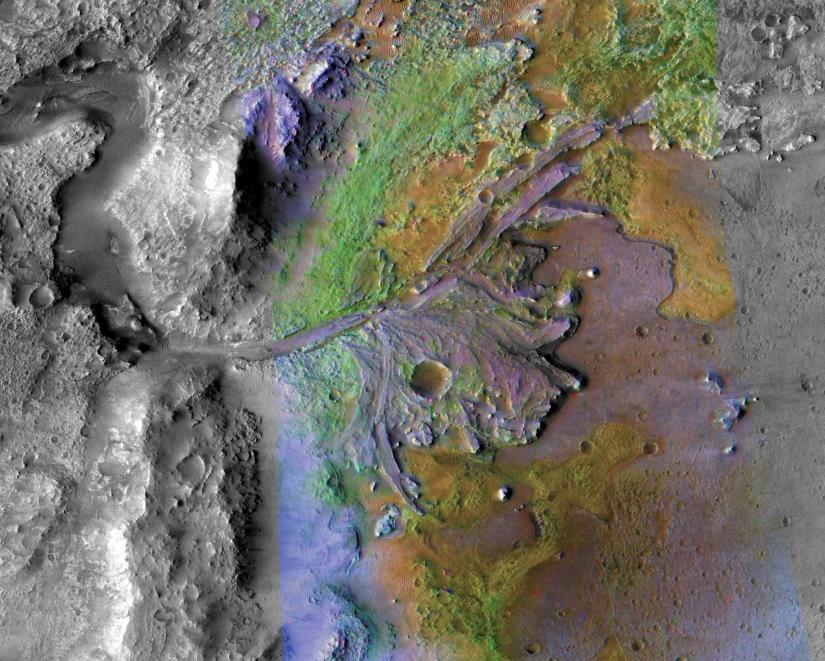 FILE PHOTO: Fans and deltas formed by water and sediment are seen in the Jezero Crater on Mars, identified as a potential landing site for the Mars 2020 Rover, in this false color image taken by NASA`s Mars Reconnaissance Orbiter, published May 15, 2019 and obtained November 15, 2019. NASA/JPL-Caltech/Handout via REUTERS