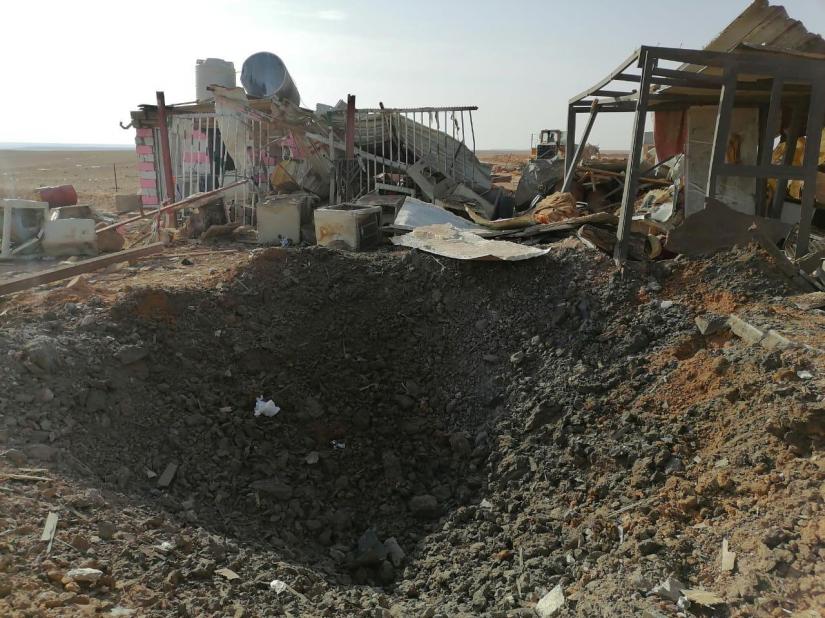 A hole left after an air strike is seen at headquarters of Kataib Hezbollah militia group in Qaim, Iraq, Dec 30, 2019. REUTERS