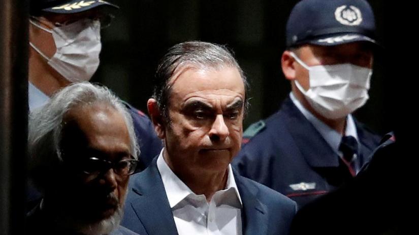 FILE PHOTO: Former Nissan Motor chairman Carlos Ghosn leaves the Tokyo Detention House in Tokyo, Japan, Apr 25, 2019. REUTERS