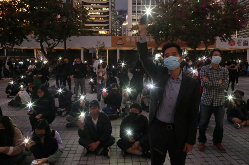FILE PHOTO: Protesters rally to remember the deaths and injuries during the months of protests, in Edinburgh Place in Hong Kong, China, Dec 30, 2019. REUTERS