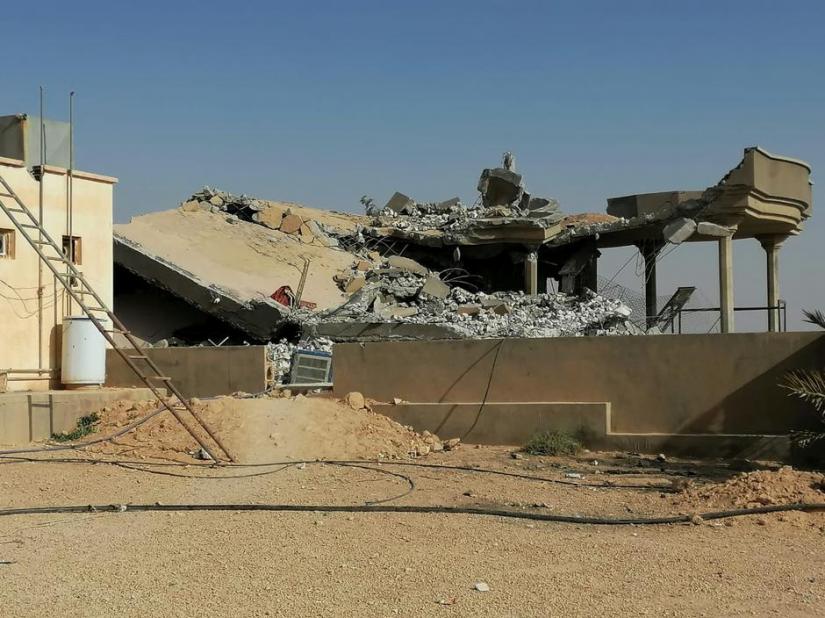 Destroyed headquarters of Kataib Hezbollah militia group are seen after in an air strike in Qaim, Iraq, Dec 30, 2019. REUTERS