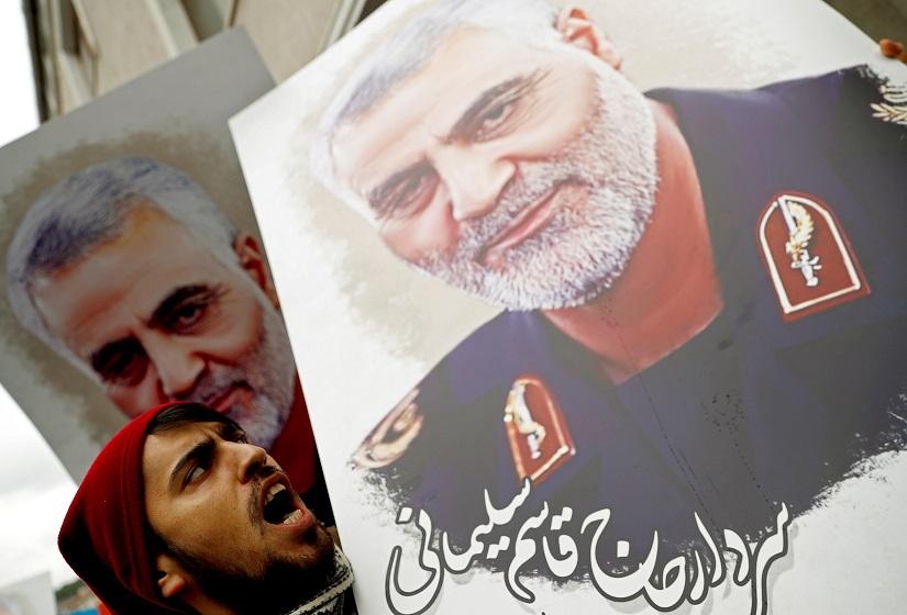 A demonstrator shouts slogans as he holds a placard depicting Iranian Major-General Qassem Soleimani, during a protest against killing of Soleimani, head of the elite Quds Force, who died in an air strike at Baghdad airport, outside US Consulate in Istanbul, Turkey, Jan 5, 2020. REUTERS