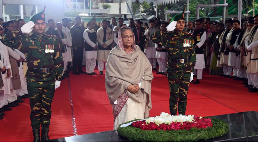 File Photo: Prime Minister Sheikh Hasina place wreaths at the portrait of Bangabandhu Sheikh Mujibur Rahman on the occasion of 49th Victory Day at Bangabandhu Memorial Museum at historic Dhanmondi 32 on December 16, 2019 PID
