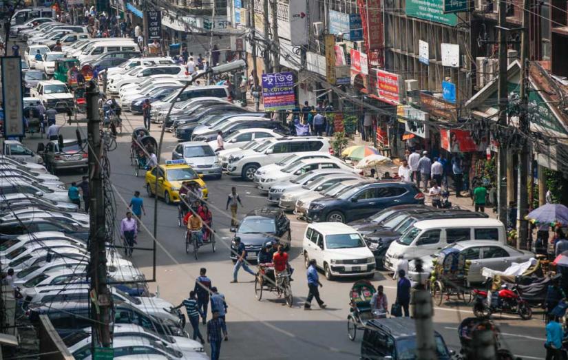 Because of a lack of parking space, people are forced to park on the street, narrowing lanes and increasing traffic in an already congested city MEHEDI HASAN/File Photo