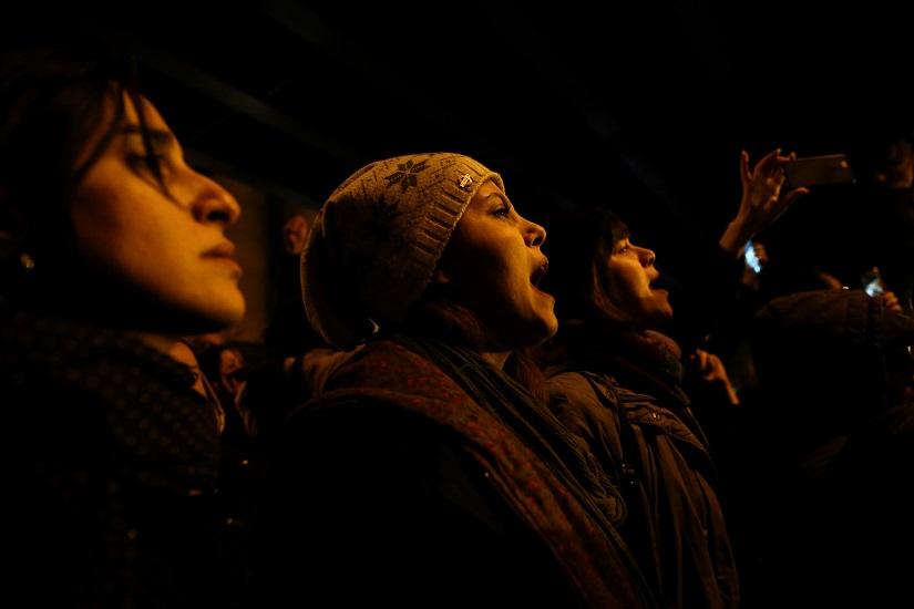 FILE PHOTO: A woman shouts slogans as she gathers with people to show their sympathy to the victims of the crash of the Boeing 737-800 plane, flight PS 752, in Tehran, Iran Jan 11, 2020. Nazanin Tabatabaee/WANA (West Asia News Agency) via REUTERS