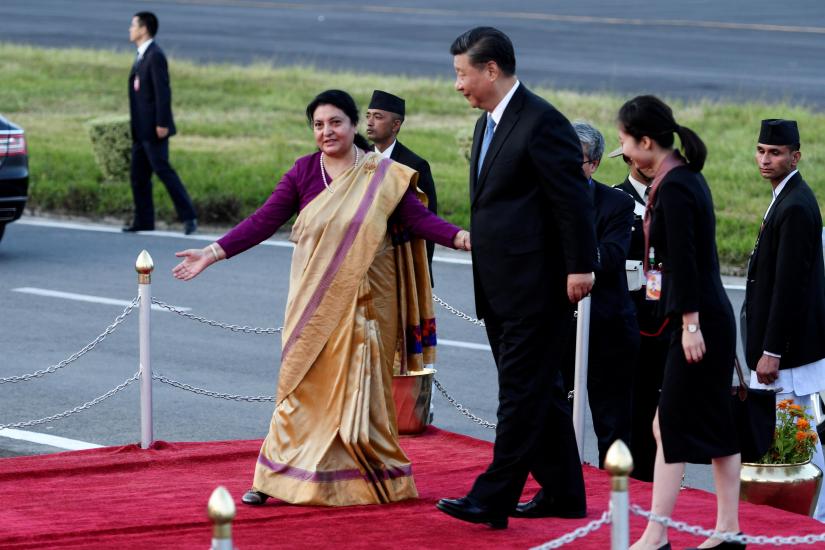 Nepalese President Bidhya Devi Bhandari welcomes Chinese President Xi Jinping for a welcome ceremony upon his arrival at Tribhuvan International Airport in Kathmandu, Nepal, Saturday, Oct. 12, 2019. Pool via REUTERS/File Photo