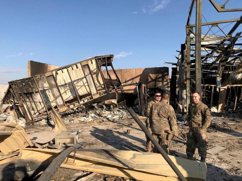 US soldiers are seen at the site where an Iranian missile hit at Ain al-Asad air base in Anbar province, Iraq Jan 13, 2020. REUTERS
